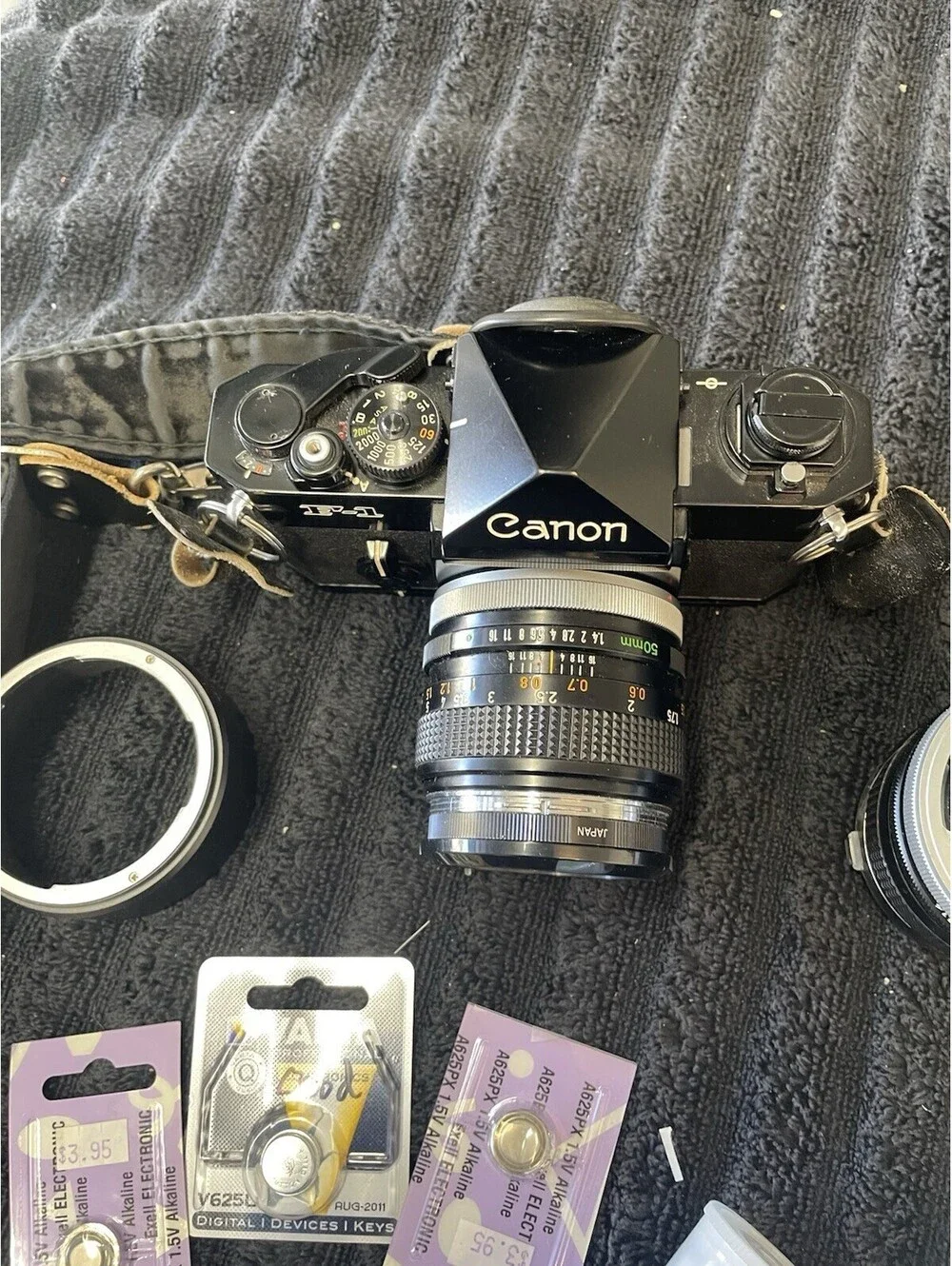 CANON F-1 FILM CAMERA WITH LENSES, CASE, FILM AND MORE  *TESTED, READ DESC*